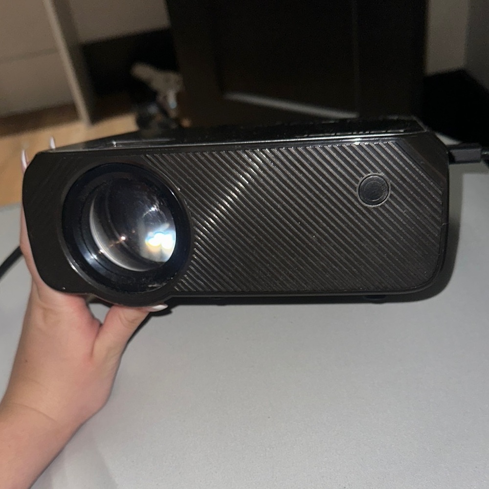 Black Bomaker Portable Projector, remote, and hdmi cord adapter!